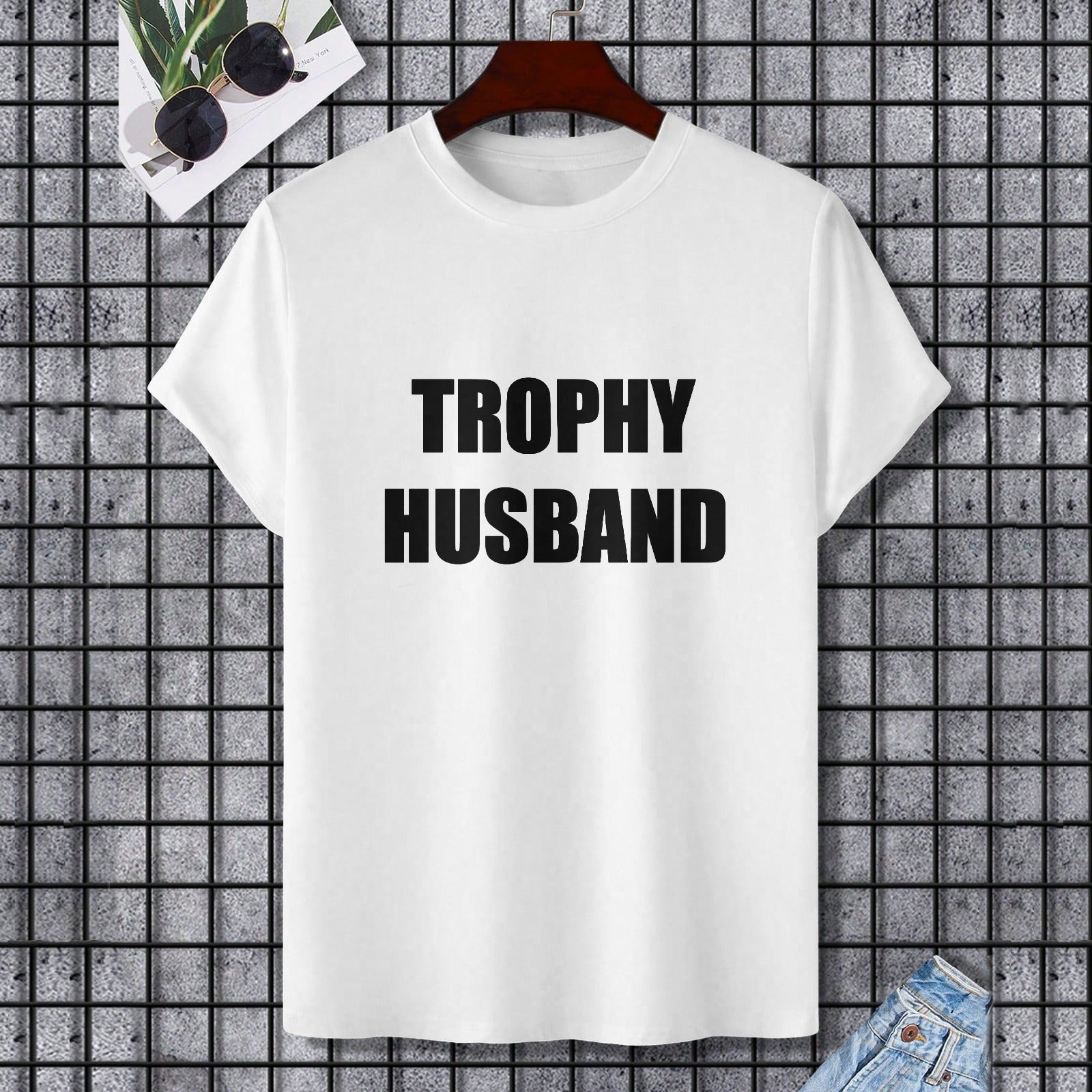 White Gildan Unisex T-shirt with black 'TROPHY HUSBAND' text, perfect for a gift.