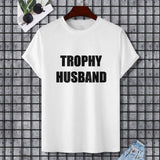 White Gildan Unisex T-shirt with black 'TROPHY HUSBAND' text, perfect for a gift.
