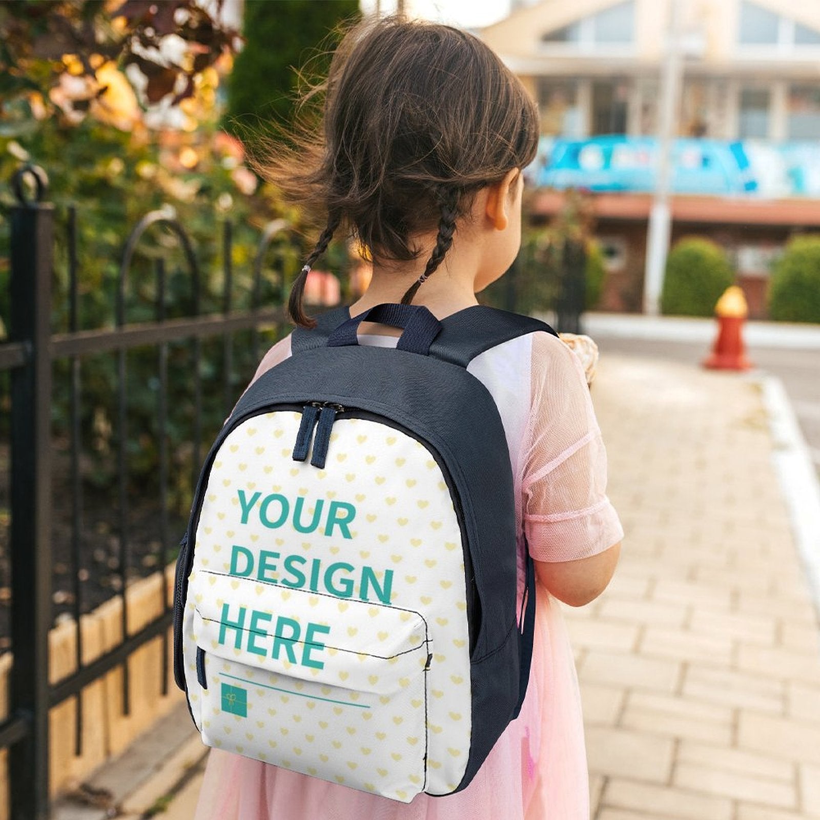Customizable kids backpack with "YOUR DESIGN HERE" on girl, school bookbag for kids, navy blue and white