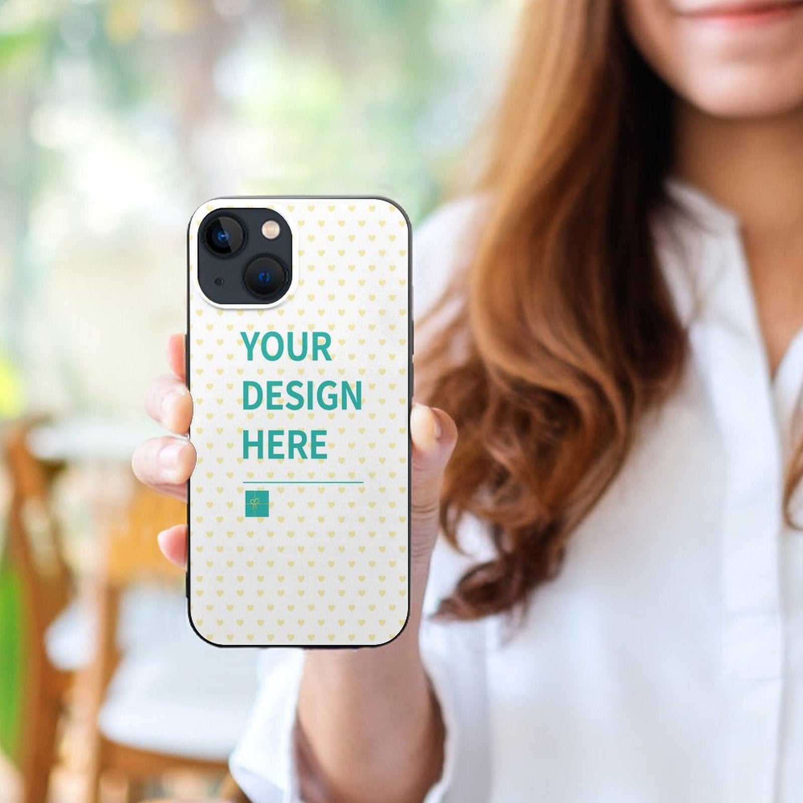 Custom iPhone 13 case with personalized design, white heart pattern, and "YOUR DESIGN HERE" text.