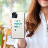 Custom iPhone 13 case with personalized design, white heart pattern, and "YOUR DESIGN HERE" text.