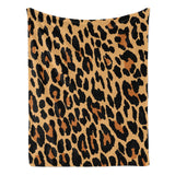 Animal print flannel blanket, leopard spots design, made in USA, soft and cozy, perfect for home decor and gifting.