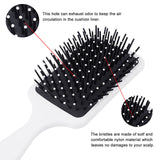 Air cushion massage hair brush with white handle, soft nylon bristles for gentle scalp massage.