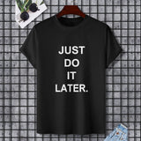 Black Gildan Unisex T-shirt with "JUST DO IT LATER." text, comfortable cotton tee.