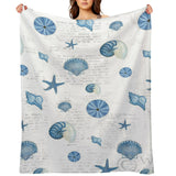 Navy shells pattern fleece blanket with seashell and starfish design, cozy blanket for bed and sofa, made in USA.