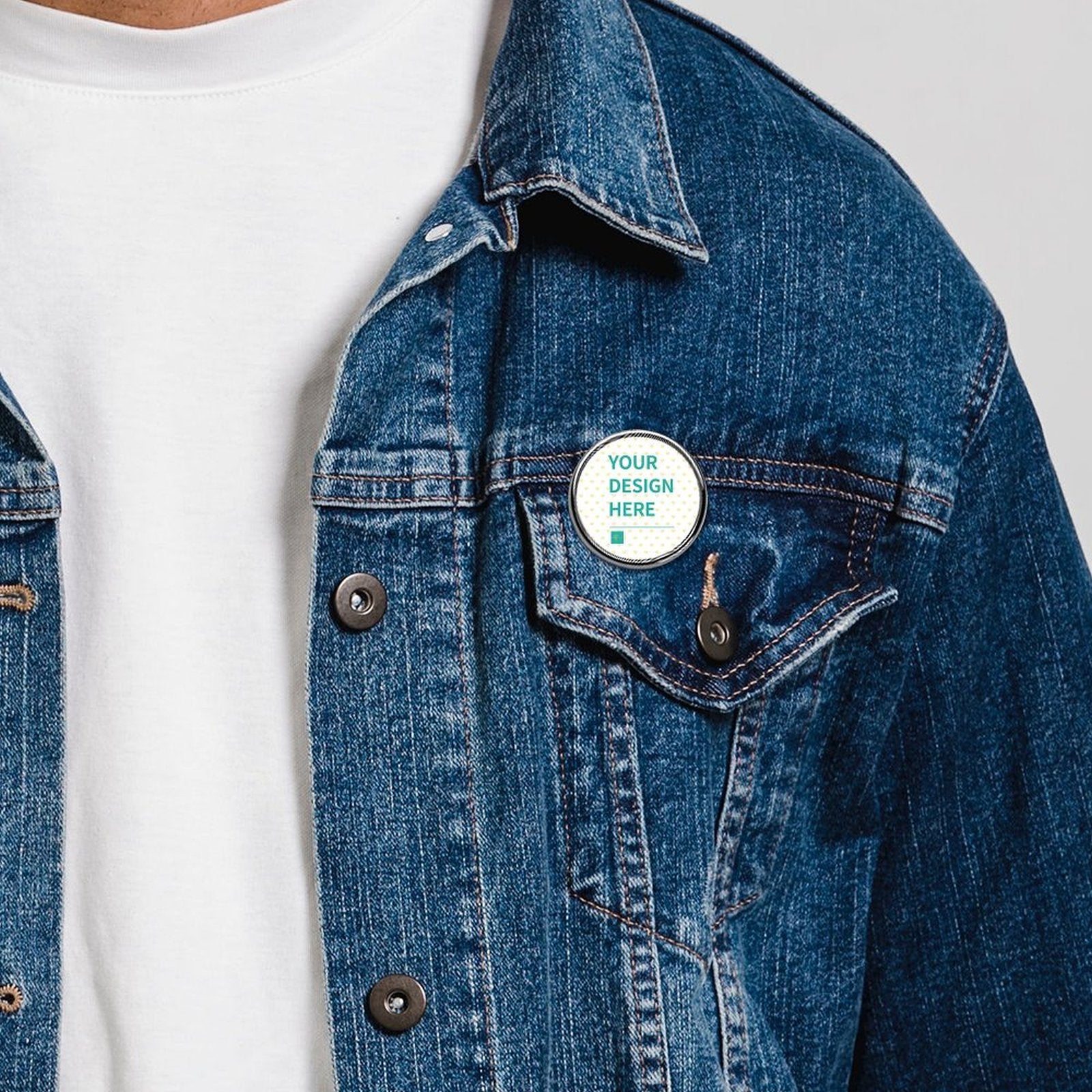 Custom alloy pin with YOUR DESIGN HERE on blue jacket, personalized lapel pin