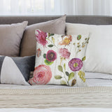 Watercolor floral plush throw pillow cover on bed. Decorative pillow with soft fabric.