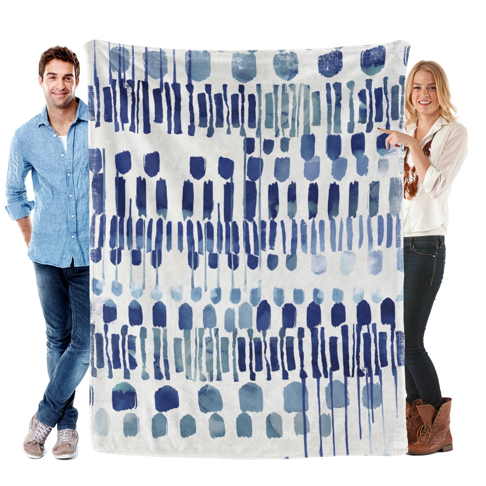 Modern blue abstract flannel blanket, held by a man and woman, cozy decor