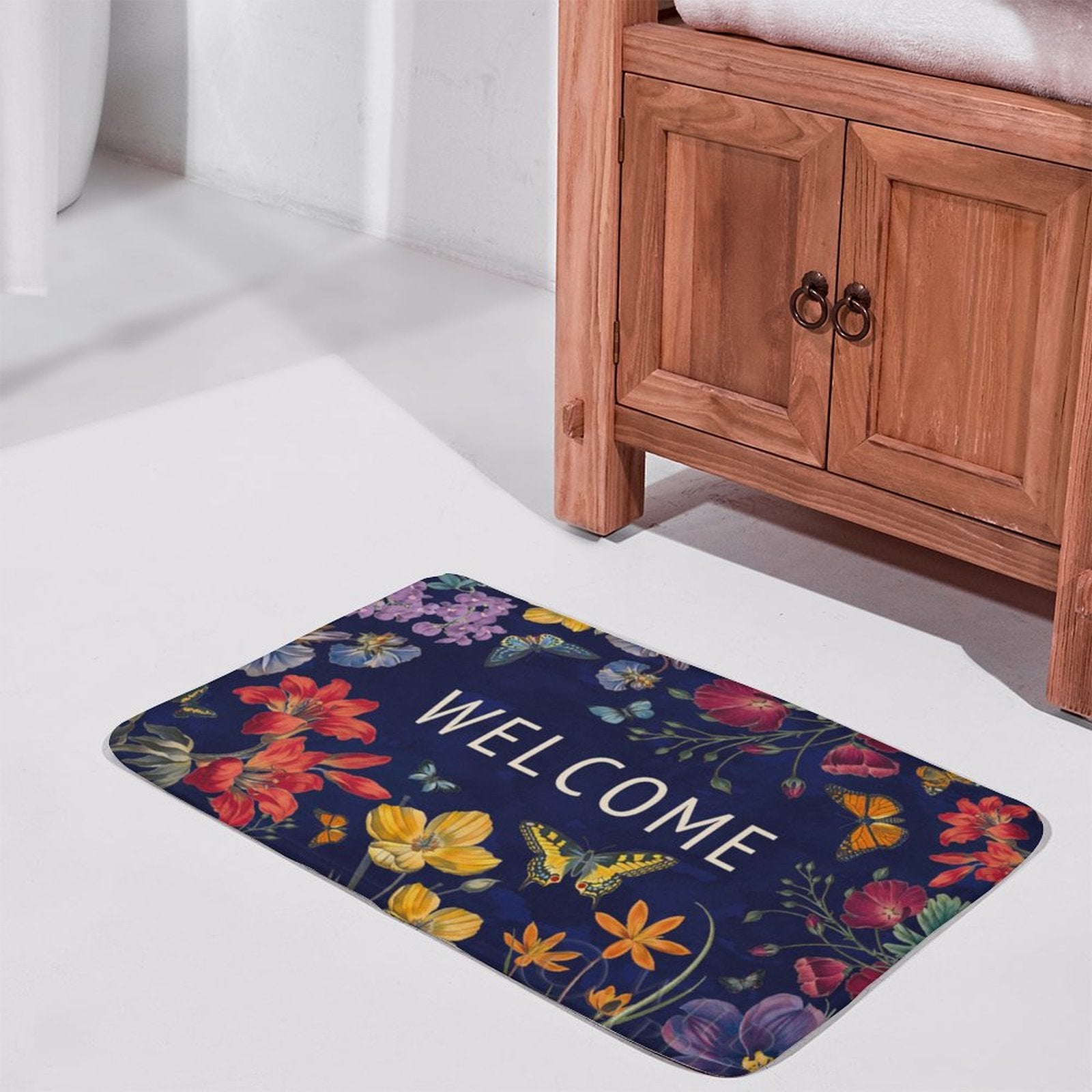 Coral velvet bath rug with floral and butterfly design; "WELCOME" bath mat for bathroom or kitchen.