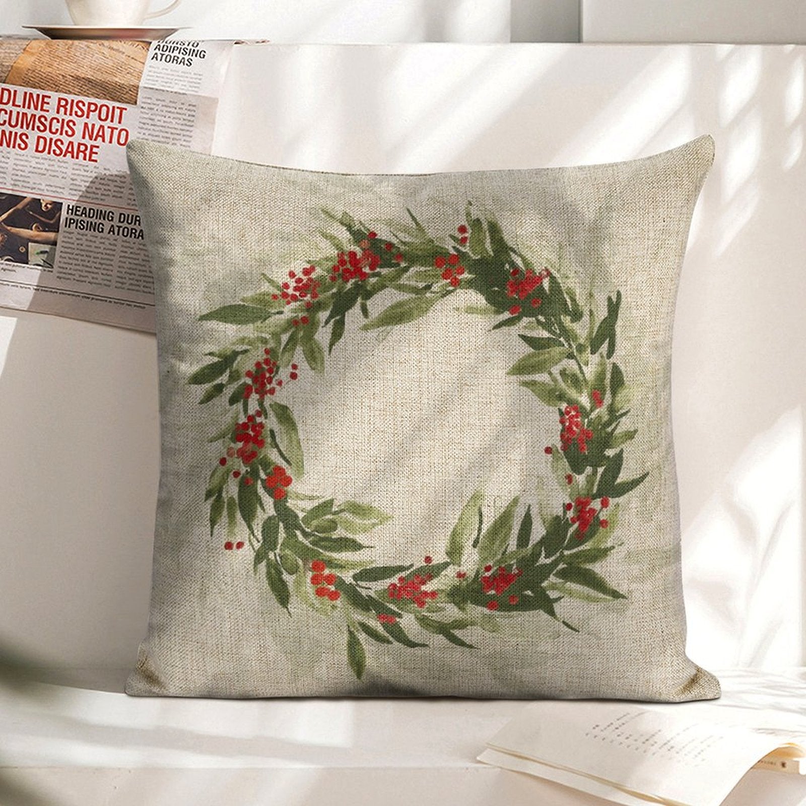 Linen Christmas pillow cover with wreath design and red berries; square cushion for sofa, couch, or bed.