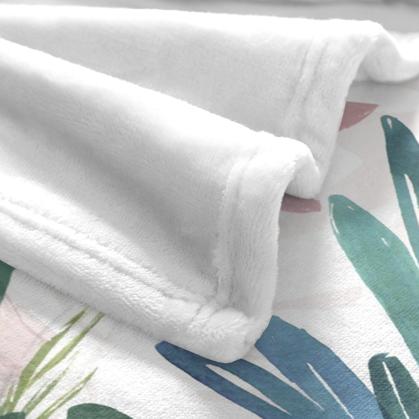 Soft white Tropical Plants flannel blanket, USA-made, with green and blue palm leaves design for sofa or bed