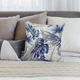 Decorative blue tropical leaf pillow cover for sofa or couch. Soft, fluffy short plush fabric for home decor.