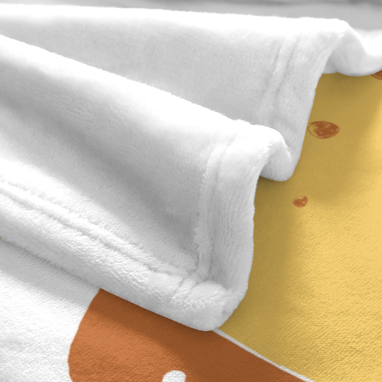 Close-up of super soft white flannel blanket. Features a giraffe design. Perfect for kids and babies.