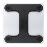 Tempered glass digital bathroom scale underside view with black frame, battery compartment, and non-slip feet.