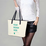 Customizable leather tote bag for women. Features black handles and "Your Design Here" text, perfect for shopping or travel.
