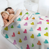 Lamb wool fleece blanket with colorful heart pattern, a cozy blanket for bed, sofa, couch, or travel. Made in the USA.
