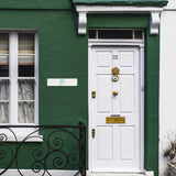 Custom metal sign 'YOUR DESIGN HERE' on green wall, personalized outdoor decor for home or office