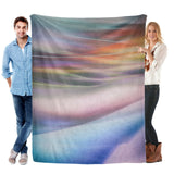 Colorful flannel blanket held by a couple, perfect for sofa or bed, made in USA