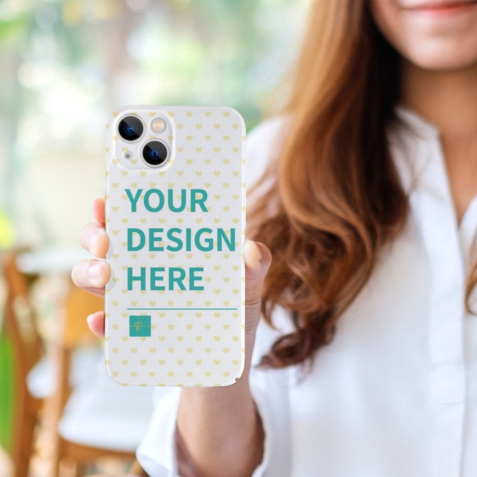 Custom iPhone 14 series phone case with 'YOUR DESIGN HERE' design, heart pattern, and PC plastic protection