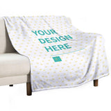 Custom fleece blanket with heart pattern on a sofa, featuring customizable design option.