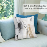Abstract art pillow cover for sofa, with soft fabric, black, white, gold tones. Cozy living room decor.