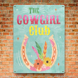 Cowgirl Club tin sign with horseshoe, feathers, and floral design, home decor. Made in USA.