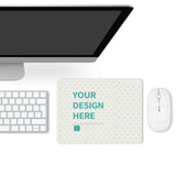 Customizable desk mat with "YOUR DESIGN HERE" text, white mouse, keyboard, and monitor setup for office or home.