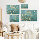 Van Gogh Almond Blossom canvas prints wall art. Teal background, white flowers on a modern living room wall decor.