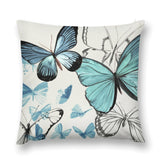 Butterfly pillow cover, featuring blue and black butterflies on a white background, made from soft plush material.