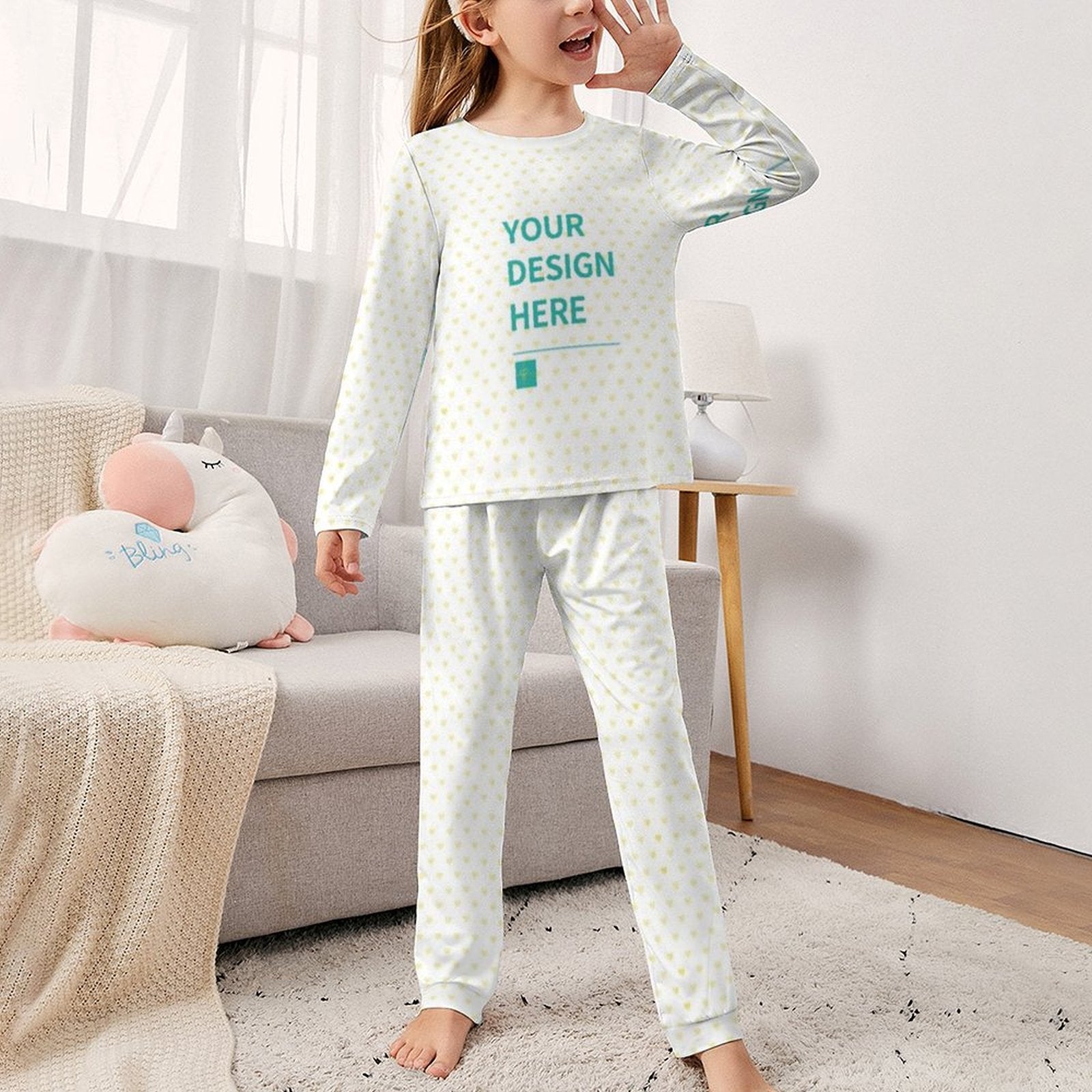 Personalized girl's pajama set with 'YOUR DESIGN HERE' text, soft material, white with heart pattern, comfortable sleepwear.