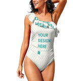 Customizable one-piece swimsuit for women with "YOUR DESIGN HERE" text, white with heart patterns, one-shoulder design.