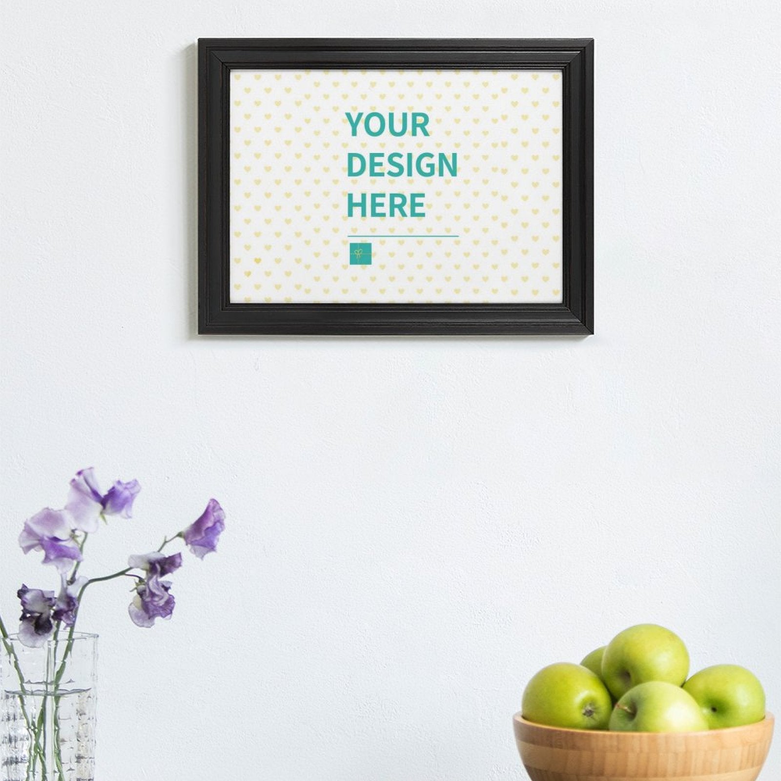 Custom canvas print with 'YOUR DESIGN HERE' text, black frame, and minimalist decor.