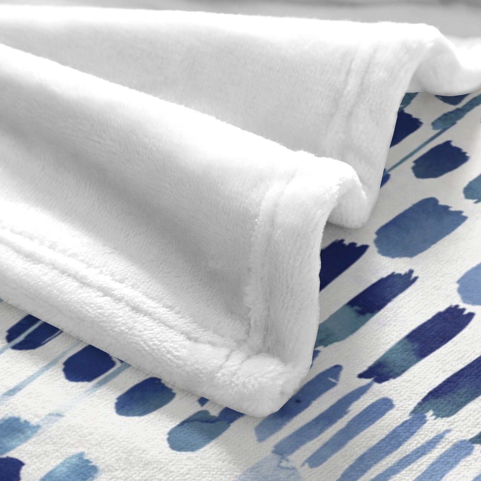 Modern blue abstract flannel blanket detail, soft and cozy for sofa, couch, and bed