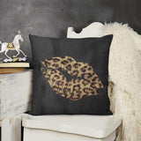 Leopard print kiss plush pillow cover on a black background. Decorative soft throw pillow for sofa and living room