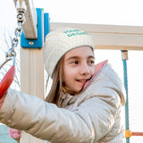 Customizable baby beanie hat with "YOUR DESIGN" text for kids, polyester knit, young girl on playground