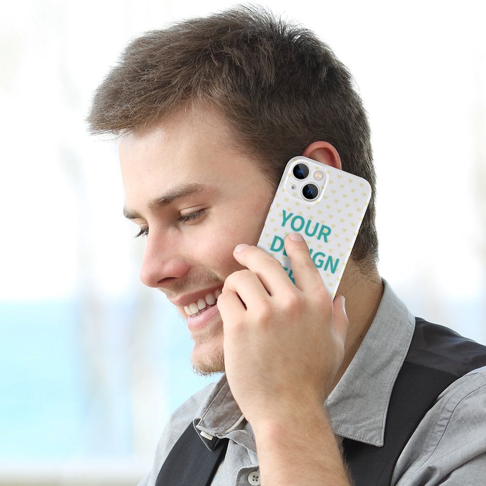 Custom iPhone 14 case, PC plastic, 'YOUR DESIGN' text, heart pattern. User using case.