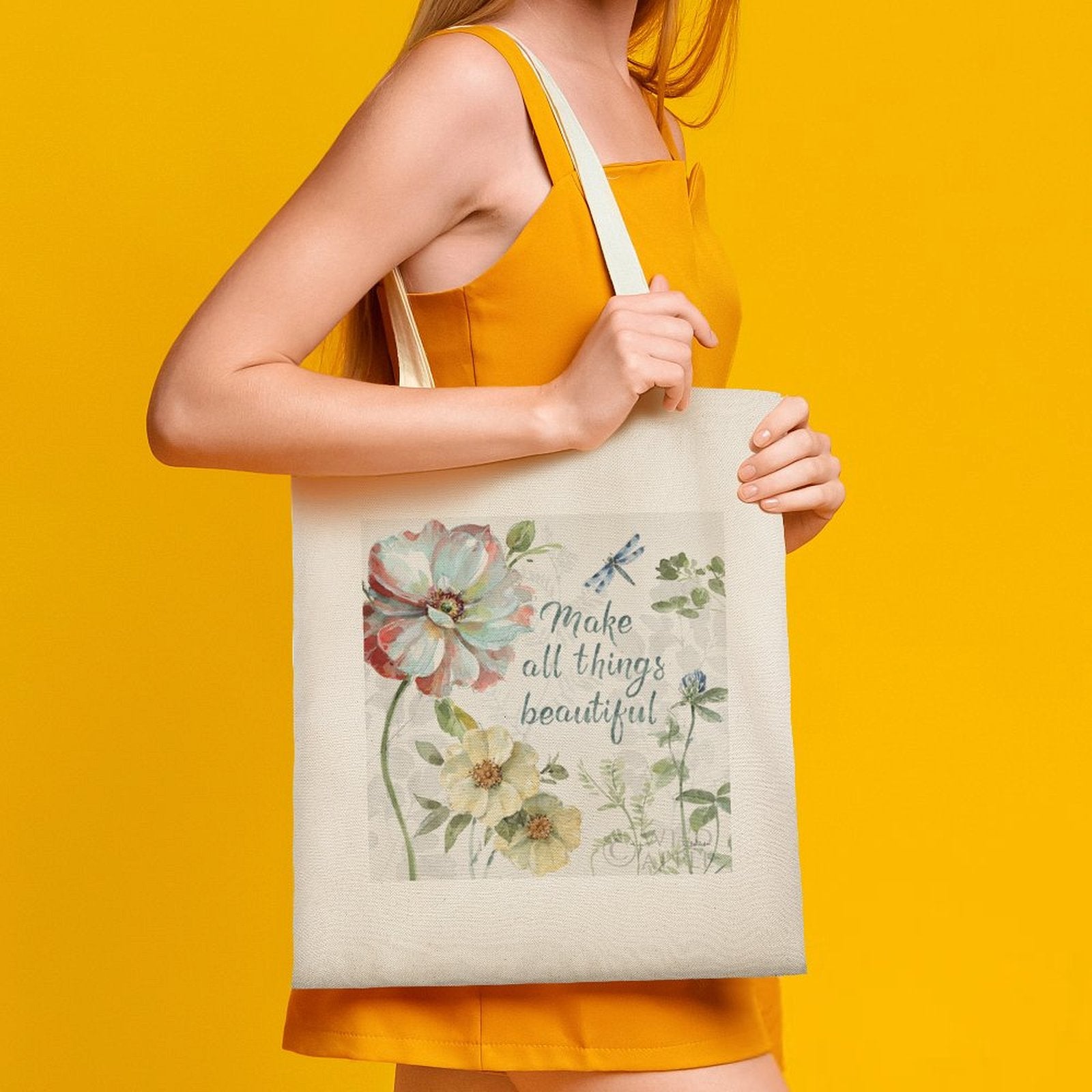 Canvas tote bag with floral print and 'Make all things beautiful' quote, perfect for shopping and everyday use.