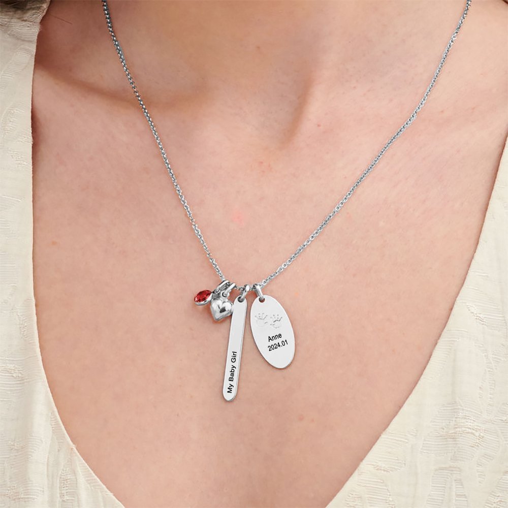 Silver custom name necklace for women, engraved with baby's name, footprints and date. Personalized jewelry gift.