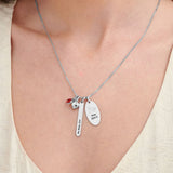 Silver custom name necklace for women, engraved with baby's name, footprints and date. Personalized jewelry gift.