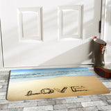 Love doormat featuring a beach scene for indoor/outdoor use, front of white door, with boots