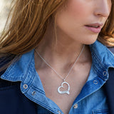 Personalized silver heart necklace with engraved names for women. Custom pendant jewelry gift.