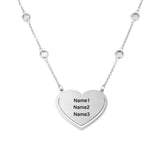 Personalized silver heart pendant necklace, custom engraved with names. Ideal gift for couples.