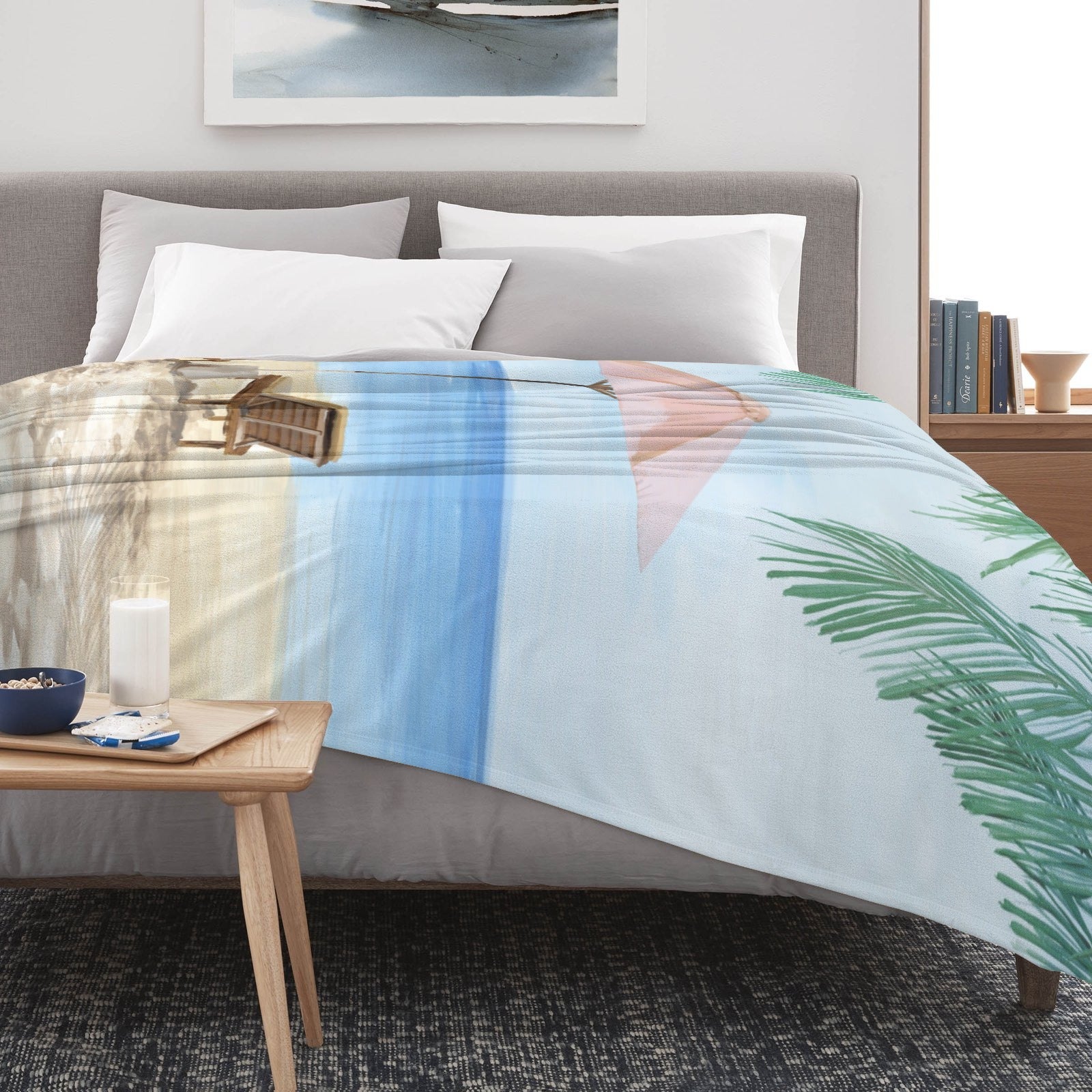 Summer Beach Flannel Blanket with beach scene on bed. Lightweight, stylish, perfect for sofa or couch.