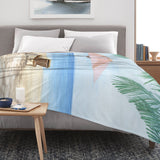 Summer Beach Flannel Blanket with beach scene on bed. Lightweight, stylish, perfect for sofa or couch.