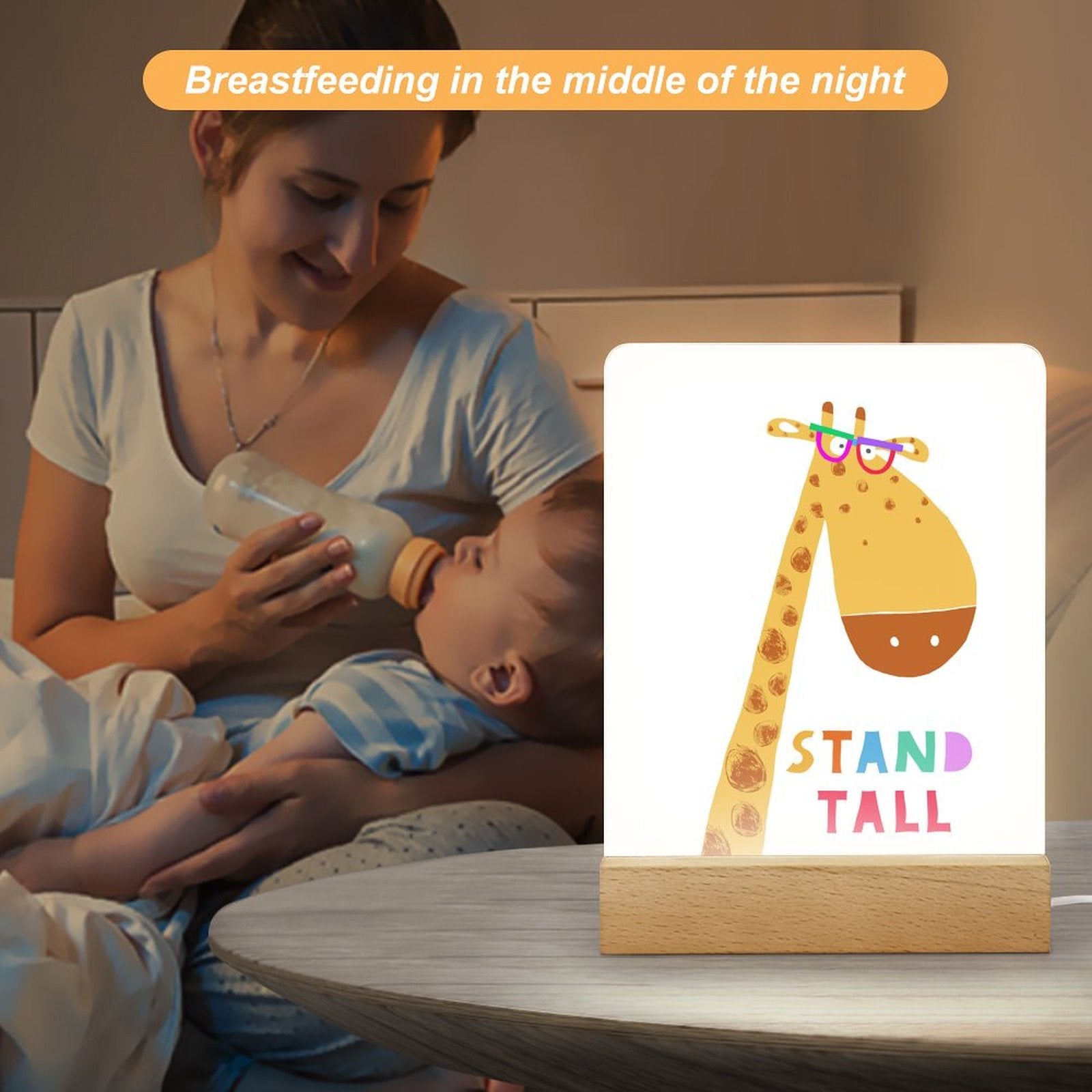Acrylic night light with giraffe design, wooden base, and a mom feeding her baby, great gift for kids.