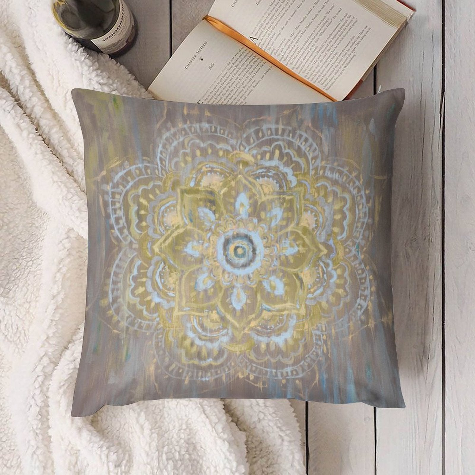 Plush throw pillow cover with mandala design in gold and light blue hues. Decorative accent for sofa or living room.