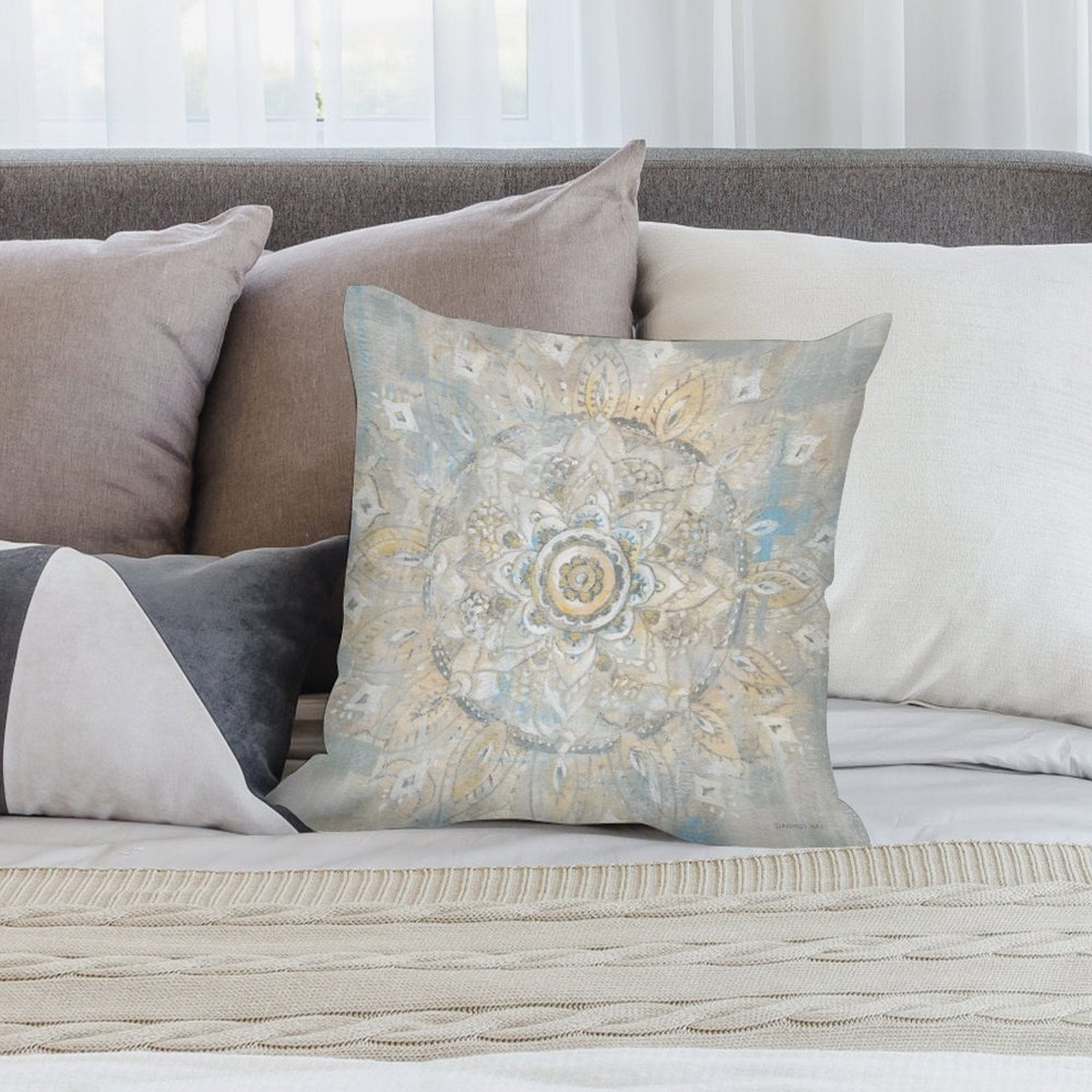 Mandala design plush throw pillow cover in soft beige, blue, and yellow hues, creating a cozy living room decor.