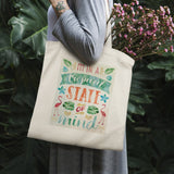 Canvas tote bag, "I'm in a Tropical State of Mind" design, perfect for shopping and travel.