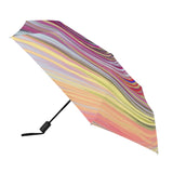 Windproof travel umbrella with abstract art design, portable sun and rain protection.