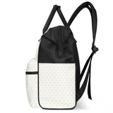 Black and white baby backpack with yellow heart pattern, large capacity, multi-pocket design.